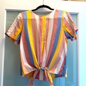 Tie front top with button detail in the back.